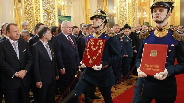 May 7, 2012. The specially prepared copy of the official text of the Russian Constitution of 1993 as amended and the Badge of the Russian President consisting of the badge and the chain are being carried into St Andrew Hall of the Grand Kremlin Palace during the inauguration of President-elect Vladimir Putin. - Sputnik Africa