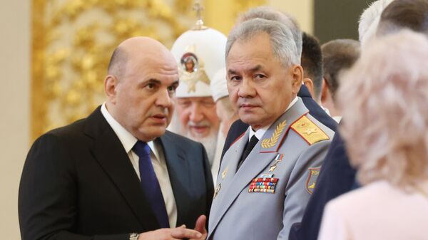 Russian Prime Minister Mikhail Mishustin and Defence Minister Sergei Shoigu wait before a ceremony inaugurating Vladimir Putin as President of Russia at the Kremlin in Moscow, Russia, on Tuesday, May 7, 2024. - Sputnik Africa
