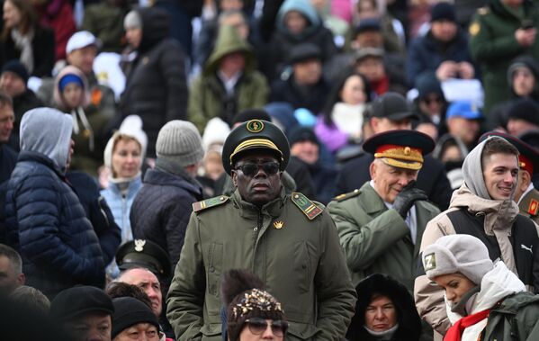 Guests gather on the stands before the start of the military parade on Red Square. - Sputnik Africa