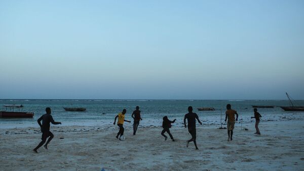 Zanzibari children play football on a beach facing the Indian Ocean at Matemwe village, northeastern Zanzibar, Tanzania, Wednesday, Jan. 28, 2015. - Sputnik Africa