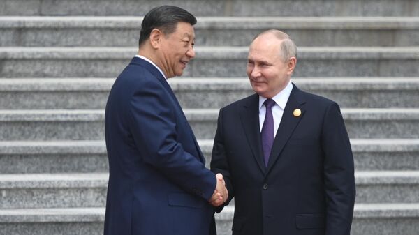 Xi Jinping  et Vladimir Poutine à Pékin, le 16 mai 2024 - Sputnik Afrique