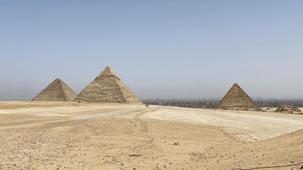 The pyramids of Cheops, Chephren and Mykerin (left to right) on the Giza Plateau on the outskirts of Cairo. - Sputnik Africa