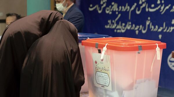 Women cast their ballots at a polling station during the presidential election, at the Hosseiniyeh Jamaran Mosque, in Tehran, Iran.  - Sputnik Africa