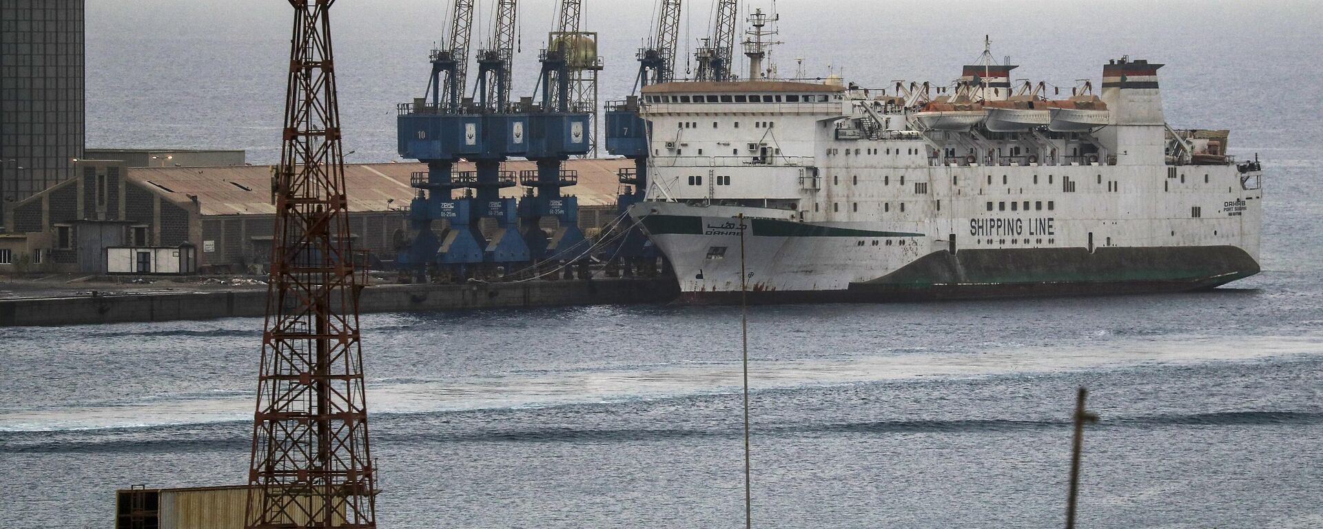 This picture taken on October 9, 2021, shows a view of the Sudan-flagged Dahab roll-on/roll-off (ro-ro) ferry vessel docked in Port Sudan along the Red Sea in the country's northeast. - Sputnik Africa, 1920, 01.06.2024