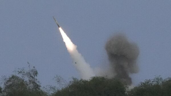 A US M142 High Mobility Artillery Rocket System (HIMARS) fires a missile during a Combined Joint Littoral Live Fire Exercise at the joint military exercise called Balikatan, Tagalog for shoulder-to-shoulder in a Naval station in Zambales province, northern Philippines on Wednesday, April 26, 2023 - Sputnik Africa