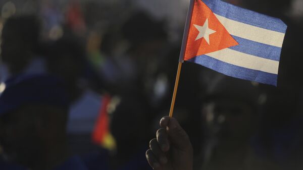 A person waves a Cuban flag during a gathering marking International Workers' Day at Jose Marti 
Anti-Imperialist Square in Havana, Cuba, Wednesday, May 1, 2024. - Sputnik Africa
