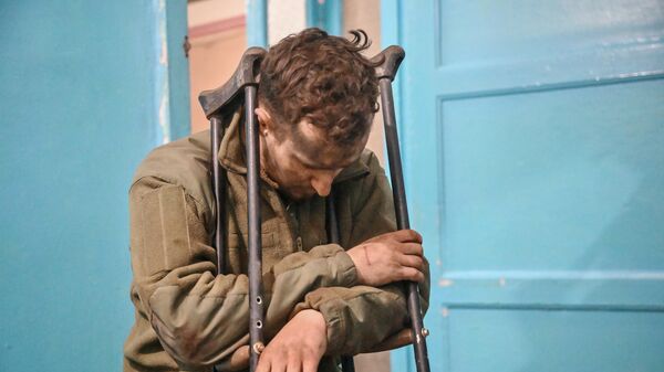 A serviceman of the Armed Forces of Ukraine, who surrendered in Mariupol, in the Novoazovsky Central District Hospital. Hospital doctors provided medical assistance to the prisoner. - Sputnik Africa