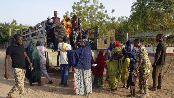 Women and children who were held captive by islamic extremists, and rescued by Nigeria's army, are seen upon arrival in Maiduguri, Nigeria, Monday, May 20, 2024. - Sputnik Africa