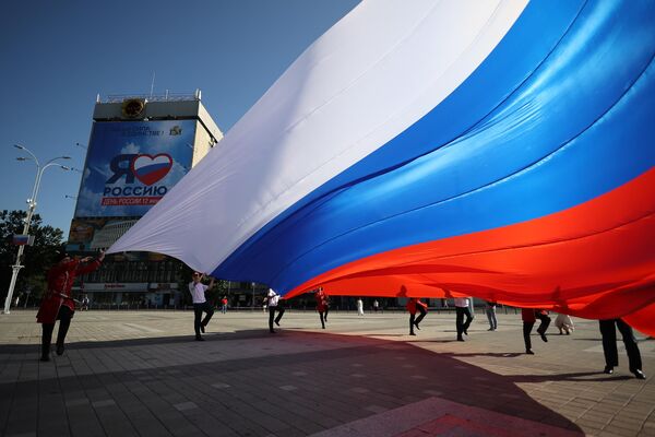 The ceremonial raising of the national flag of the Russian Federation on the main city square of Krasnodar as part of the celebration of Russia Day. - Sputnik Africa