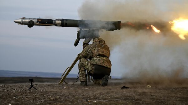 A serviceman of the Tsentr Battlegroup of Russian Armed Forces perfects his skills in firing Kornet anti-tank missile system. - Sputnik Africa