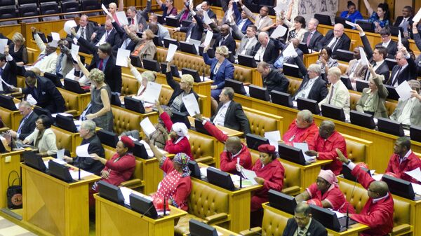 Members of the official opposition Democratic Alliance (DA) party on left and back, and members of the Economic Freedom Fighters (EFF) in red, right, heckle during parliamentary proceedings in Cape Town, South Africa, Thursday, Nov. 13, 2014. - Sputnik Africa