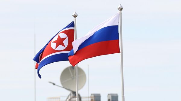 Flags of Russia and the DPRK at the Vostochny cosmodrome. - Sputnik Africa