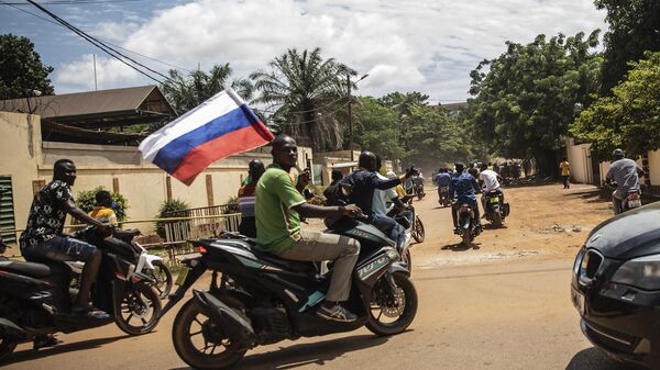  Supporters of Capt. Ibrahim Traore parade wave a Russian flag in the streets of Ouagadougou, Burkina Faso, Oct. 2, 2022. - Sputnik Africa