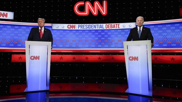 President Joe Biden, right, and Republican presidential candidate former President Donald Trump, left, stand during break in a presidential debate hosted by CNN, Thursday, June 27, 2024, in Atlanta. - Sputnik Africa