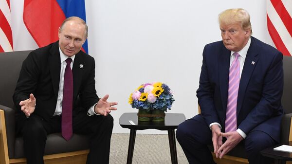 Russian President Vladimir Putin and U.S. President Donald Trump attend a bilateral meeting at the Group of 20 (G20) leaders summit in Osaka, Japan - Sputnik Africa