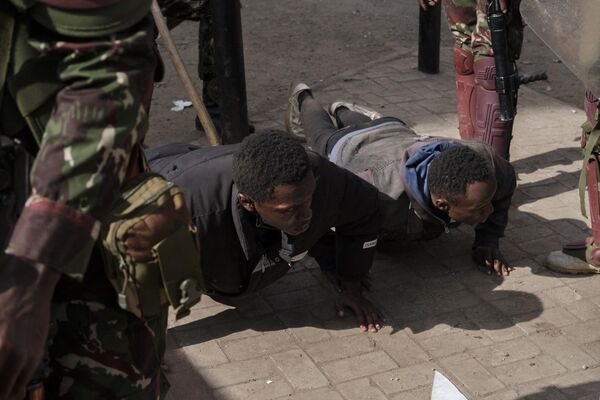 Detained protesters are seen doing push-ups during an anti-government demonstration called following nationwide deadly protests over tax hikes and a controversial now-withdrawn tax bill in downtown Nairobi, on July 2, 2024. - Sputnik Africa