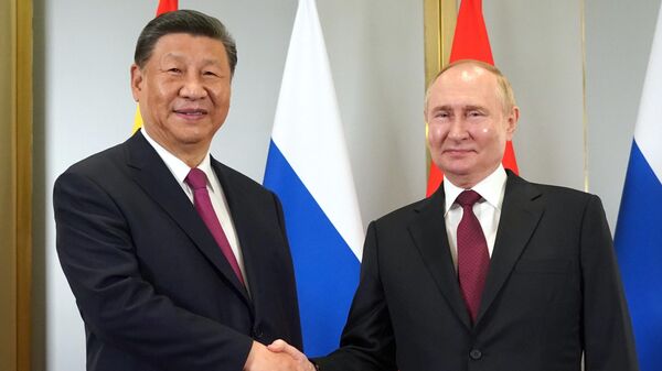 Russian President Vladimir Putin and Chinese President Xi Jinping (left) during a meeting on the sidelines of the Shanghai Cooperation Organization (SCO) summit. - Sputnik Africa