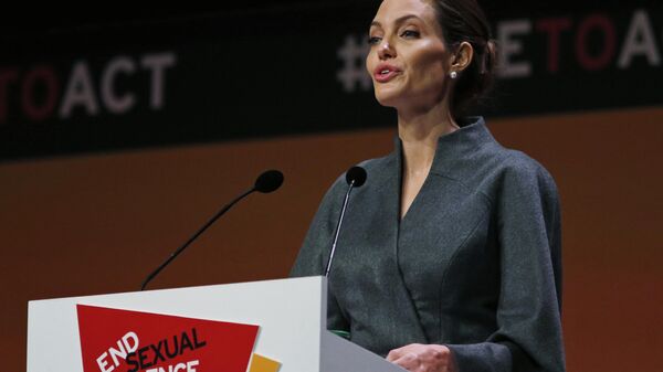 US actress Angelina Jolie, Special Envoy of the United Nations High Commissioner for Refugees, delivers her closing speech at the 'End Sexual Violence in Conflict' summit in London, Friday, June 13, 2014. - Sputnik Africa