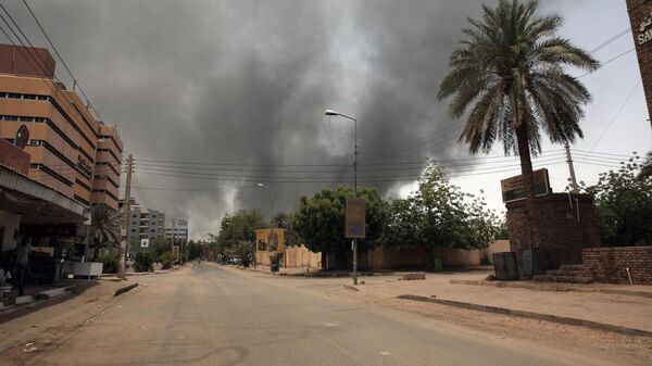 Smoke is seen rising from a neighborhood in Khartoum, Sudan, Saturday, April 15, 2023. Fierce clashes between Sudan's military and the country's powerful paramilitary erupted in the capital and elsewhere in the African nation after weeks of escalating tensions between the two forces.  - Sputnik Africa