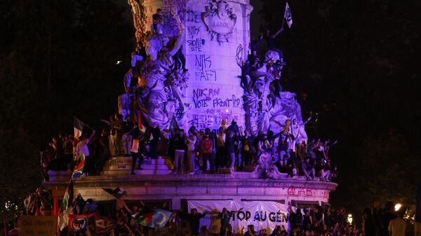 People gather at the statue on Republique plaza following the second round of the legislative elections, Sunday, July 7, 2024 in Paris - Sputnik Africa