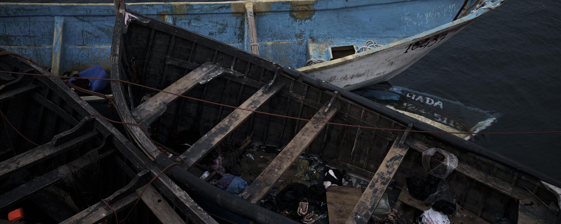 Empty boats used by migrants are moored at the port of Arguineguin in the Canary island of Gran Canaria, Spain - Sputnik Africa, 1920, 16.09.2024