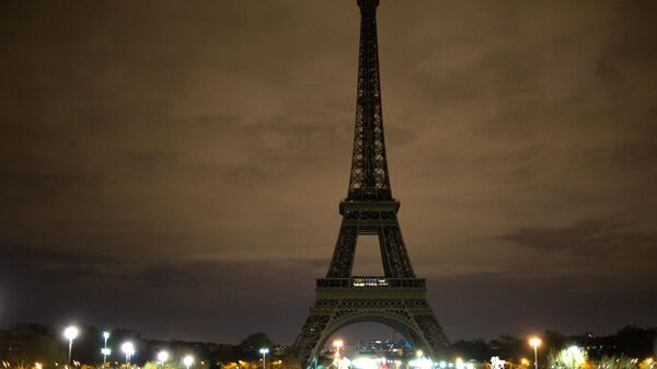 The Eiffel Tower in Paris with its lights turned off in memory of the victims of the terrorist attack in London. - Sputnik Africa