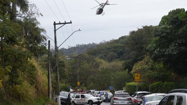 Police patrol the street leading to the gated community where a plane crashed in Vinhedo, Sao Paulo state, Brazil, Friday, Aug. 9, 2024.  - Sputnik Africa