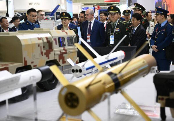 Foreign military officials and visitors explore the China Defense stand during the 10th International Military-Technical Forum Army-2024 at Patriot Congress and Exhibition Centre in Moscow region, Russia. - Sputnik Africa