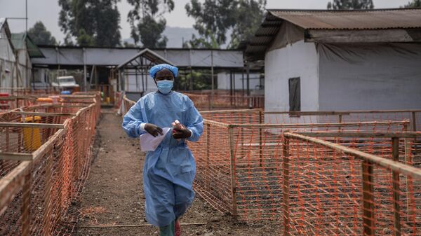 A health worker walks past a mpox treatment centre in Munigi, eastern Congo, Friday, Aug. 16, 2024.  - Sputnik Africa