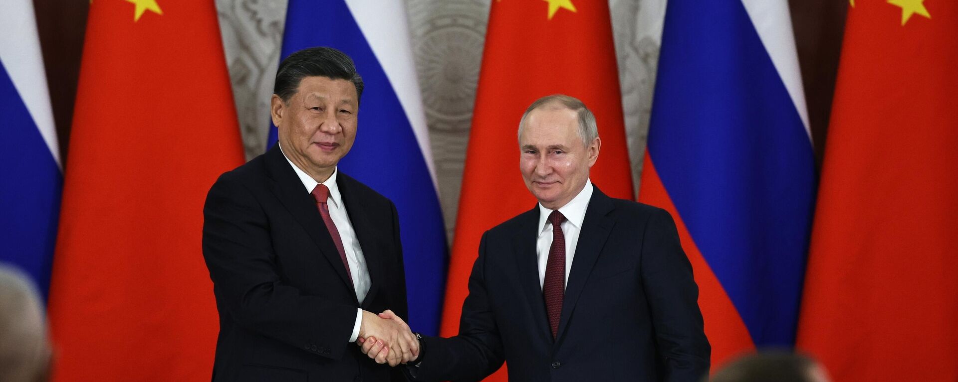 Russian President Vladimir Putin, right, and Chinese President Xi Jinping shake hands after speaking to the media during a signing ceremony following their talks at The Grand Kremlin Palace, in Moscow, Russia, March 21, 2023 - Sputnik Africa, 1920, 18.08.2024