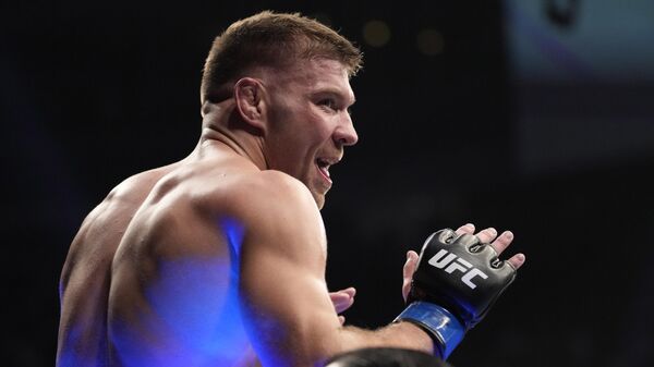 Dricus Du Plessis celebrates after defeating Darren Till during a UFC 282 mixed martial arts middleweight bout Saturday, Dec. 10, 2022, in Las Vegas. - Sputnik Africa