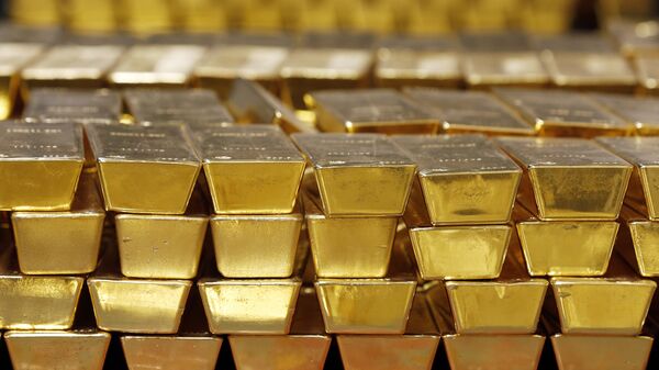 In this Tuesday, July 22, 2014, file photo, gold bars are stacked in a vault at the United States Mint, in West Point, N.Y.  - Sputnik Africa