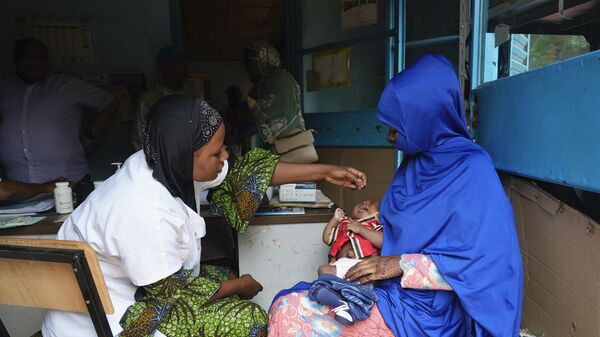 Women gather at a clinic to have their children vaccinated in Niamey, Niger, Monday, Aug. 21, 2023.  - Sputnik Africa