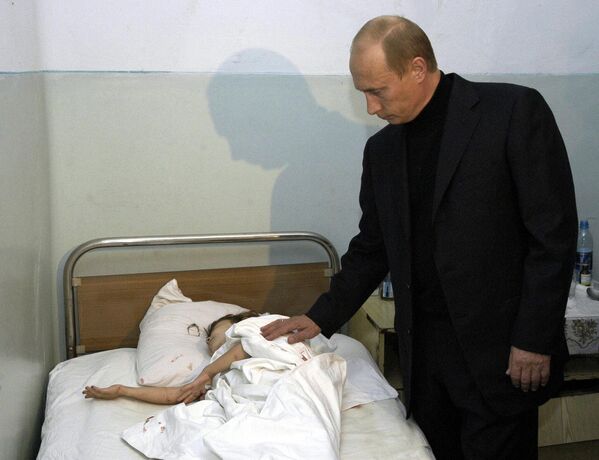 Russian President Vladimir Putin during a visit to the hospital where victims of the terrorist takeover of Beslan School No. 1 are being treated. - Sputnik Africa