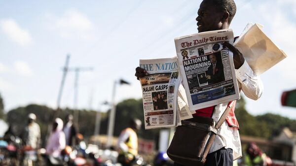 A vendor sells newspapers in Lilongwe, Malawi, Wednesday, June 12, 2024, following the death of Malawi's Vice President, Saulos Chilima, in a plane crash - Sputnik Africa