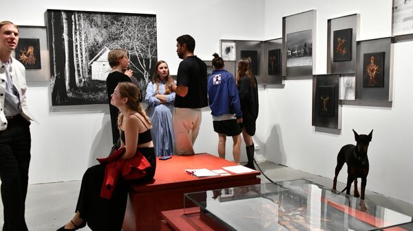 Visitors examine exhibits at the blazar contemporary art fair at the Museum of Moscow. - Sputnik Africa