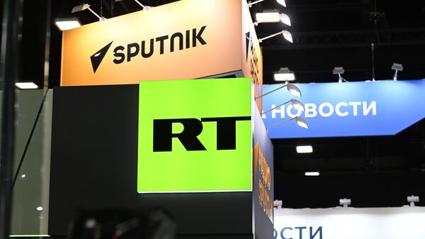 Logos de Sputnik et RT au SPIEF-2023 (archive photo) - Sputnik Afrique