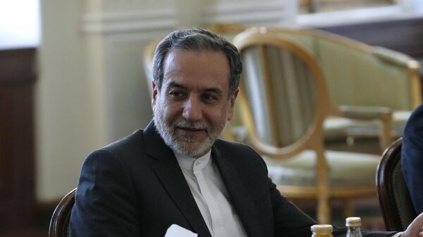 Iranian Foreign Minister Abbas Araghchi attends a meeting with Qatari Prime Minister and Foreign Minister Sheikh Mohammed bin Abdulrahman Al Thani, in Tehran, Iran, Monday, Aug. 26, 2024. - Sputnik Africa