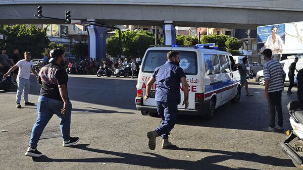 An ambulance carries wounded people whose handheld pager exploded, in Beirut, Lebanon - Sputnik Africa