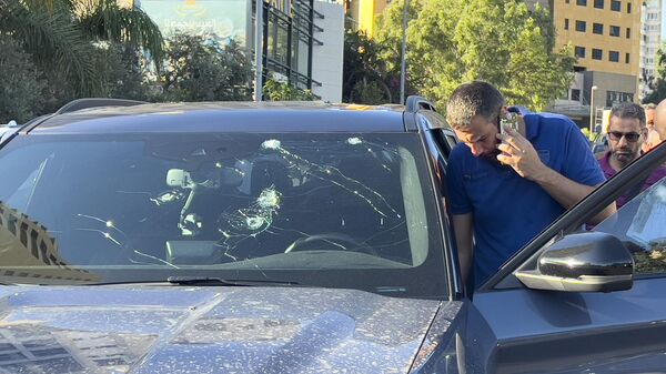 Police officers inspect a car inside of which a hand-held pager exploded, Beirut, Lebanon, Tuesday, Sept. 17, 2024.  - Sputnik Africa