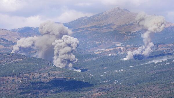 Smoke rises from Israeli airstrikes that hit Al-Rihan mountain, as seen from Marjayoun town, south Lebanon, Saturday, Sept. 21, 2024.  - Sputnik Africa