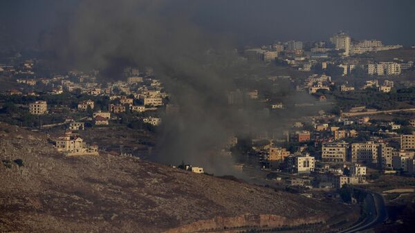 Smoke rises from an Israeli airstrike on Kfar Rouman village, as seen from Marjayoun town, south Lebanon, Monday, Sept. 23, 2024. - Sputnik Africa