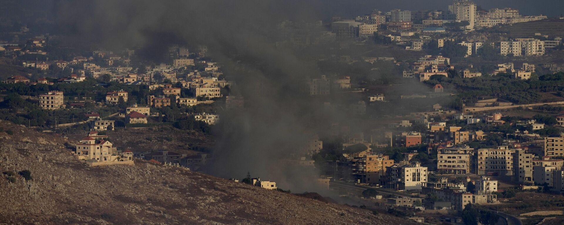 Smoke rises from an Israeli airstrike on Kfar Rouman village, as seen from Marjayoun town, south Lebanon, Monday, Sept. 23, 2024. - Sputnik Africa, 1920, 14.10.2024