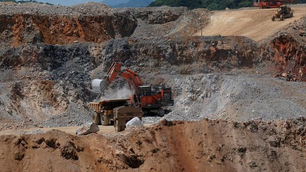 In this photo taken March 20, 2012, a power shovel uploads soil into a truck at Pueblo Viejo mine in the Sanchez Ramirez province, about 60 miles (100 kms) northwest of Santo Domingo, Dominican Republic. - Sputnik Africa