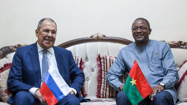 Russian Foreign Minister Sergey Lavrov (left) and Burkina Faso Foreign Minister Karamoko Jean Marie Traore during a meeting. - Sputnik Africa