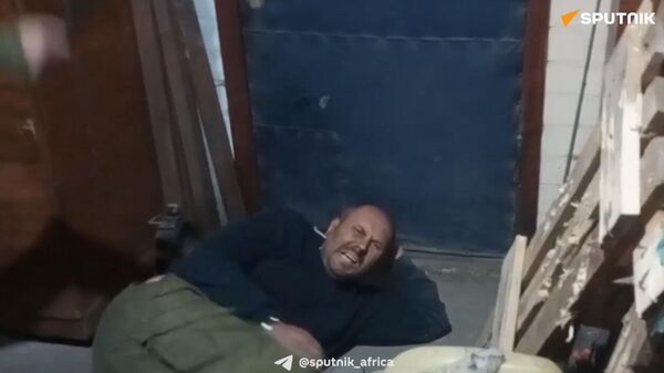 Screenshot from the video of the Russian serviceman being tortured by the Ukrainian military. - Sputnik Africa