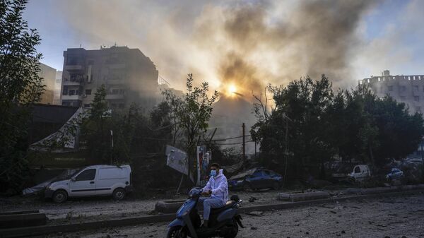 Smoke rises from the site of an Israeli airstrike in Dahiyeh, Beirut - Sputnik Africa