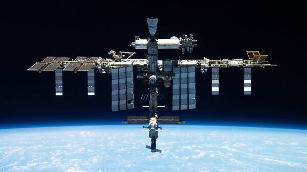 This undated photo provided by Roscosmos shows the International Space Station. On Monday, Oct. 9, 2023, the Russian space agency said there was a leak in a backup coolant line for a new science lab at the station, but the crew and station aren't in danger - Sputnik Africa