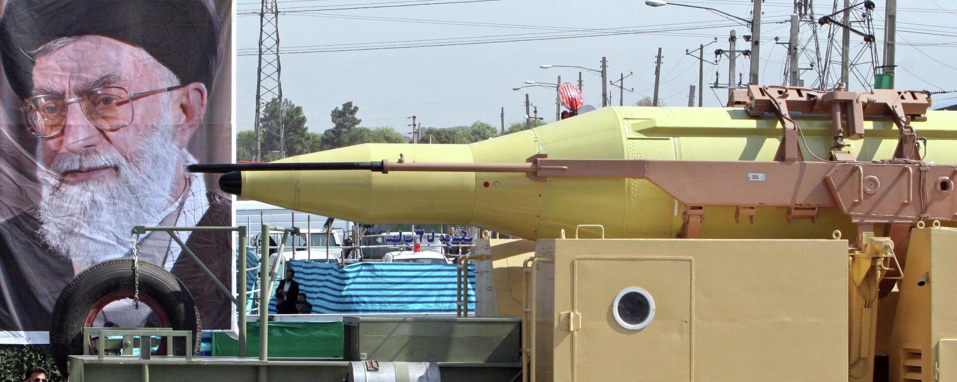 In front of a picture of supreme leader, Ayatollah Ali Khamenei, Iran's Shahab-3 missile, a weapon capable of carrying a nuclear warhead and reaching Europe, Israel and U.S. forces in the Middle East, is displayed during a parade ceremony, marking 25th anniversary of the outset of the Iran-Iraq war (1980-1988) in front of the mausoleum of the late revolutionary founder Ayatollah Ruhollah Khomeini, just outside Tehran, Iran, Thursday, Sept. 22, 2005 - Sputnik Africa, 1920, 12.10.2024