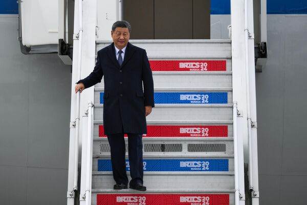 Chinese President Xi Jinping, who arrived to participate in the 16th BRICS Summit, during a welcoming ceremony at the Kazan airport. - Sputnik Africa